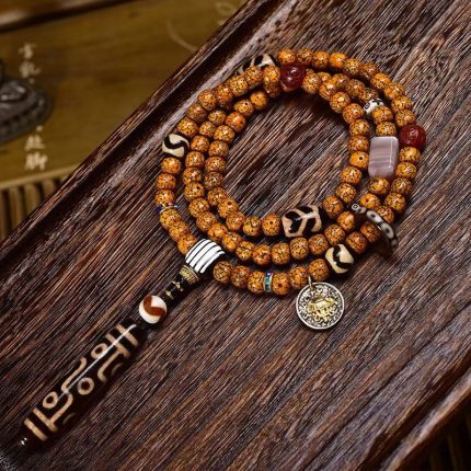 Tibetan-9-Eye-Dzi-Pendant-with-Aged-Star-Moon-Bodhi-Mala-–-Sacred-Necklace-for-Wisdom-and-Power