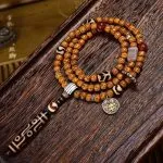 Tibetan-9-Eye-Dzi-Pendant-with-Aged-Star-Moon-Bodhi-Mala-–-Sacred-Necklace-for-Wisdom-and-Power