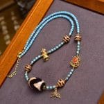 Tibetan Sky Tiger Tooth Dzi Pendant Necklace – Turquoise & Water Agate Sacred Beads - Image 4